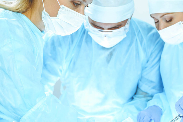 A group of surgeons is operating at the hospital. Health care concept - Fotografie, Obrázek