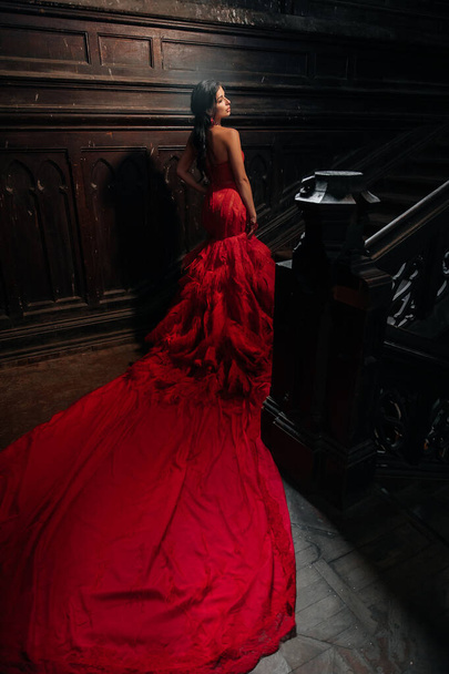 Woman Vintage Red Dress Old Castle Beautiful Princess In Seductive Dress Elegant Caucasian Female Fairy Tale story Dark Stairs - Zdjęcie, obraz