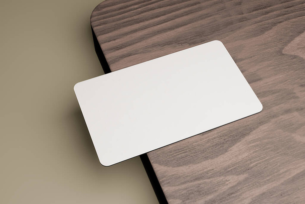 3D απόδοση μιας επαγγελματικής κάρτας που σε ένα κομμάτι καφέ ξύλου. αυτό μπορεί να χρησιμοποιηθεί για να δείξει την ταυτότητα σας, της εταιρείας σας ή άλλων. - Φωτογραφία, εικόνα