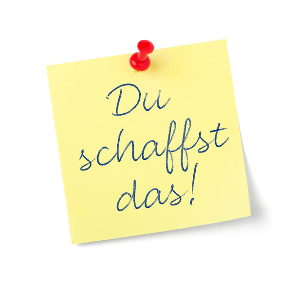 Nota en papel amarillo con texto Puedes hacerlo en alemán - Du schaffst das - Foto, Imagen
