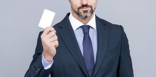 successful ceo suggest easy banking profit payment. cropped man boss in businesslike suit. contact us. call me. businessman demonstrating credit or debit card. empty plastic business name card. - Photo, Image