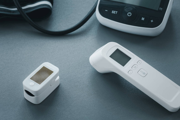 self health care instrument compose of pulse oximeter, infrared thermometer, and blood pressure, healthcare concept - Photo, Image
