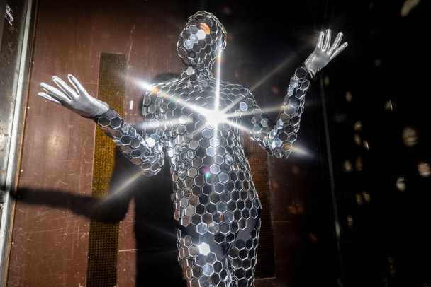 Sparkling discosuit man dancing in a lift - Photo, Image