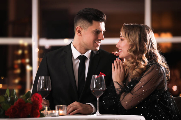 Lovely couple having romantic dinner on Valentine's day in restaurant - Foto, Imagem