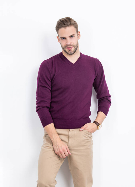 Mens clothing essentials for every wardrobe. Sexy man wear violet pullover with casual pants. Wardrobe staple. Fashion menswear. Trendy clothes. Stylish clothing. Look that will never go out of style. - Фото, изображение