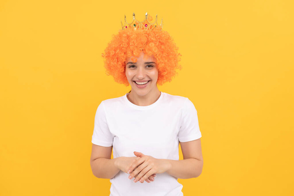 happy freaky selfish woman in curly clown wig and queen crown for party, happiness. - Photo, Image