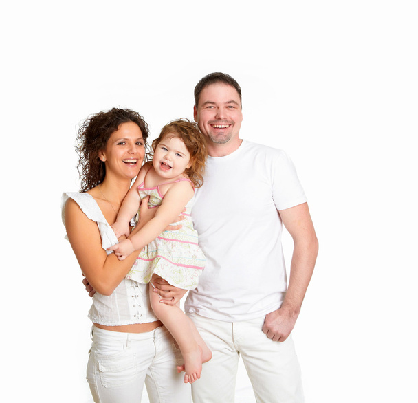 Portrait of mother, father and their child together in studio - Foto, Imagem