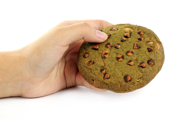 zöld tea-cookie a kezében  - Fotó, kép
