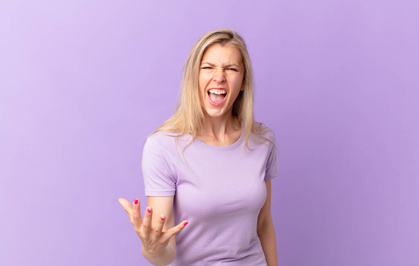 young blonde woman looking angry, annoyed and frustrated - Foto, immagini