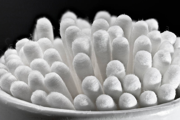 White cotton buds in macro closeup isolated on a black background - Photo, Image