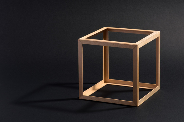 Open frame wooden cube on black - Φωτογραφία, εικόνα