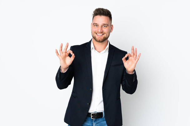 Young Russian business man isolated on white background showing an ok sign with fingers - Φωτογραφία, εικόνα