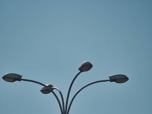 The metallic street lights against the blue sky - Photo, image
