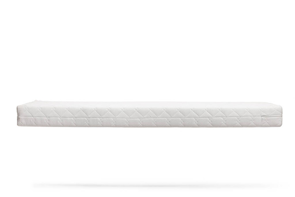 Studio shot of a white mattress floating isolated on white background - Φωτογραφία, εικόνα