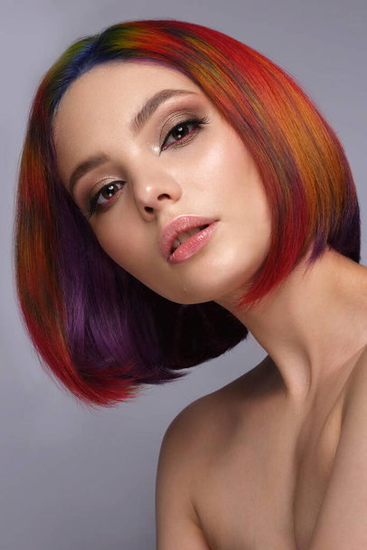 Beautiful woman with multi-colored hair and creative make up and hairstyle. Beauty face. - Foto, Bild