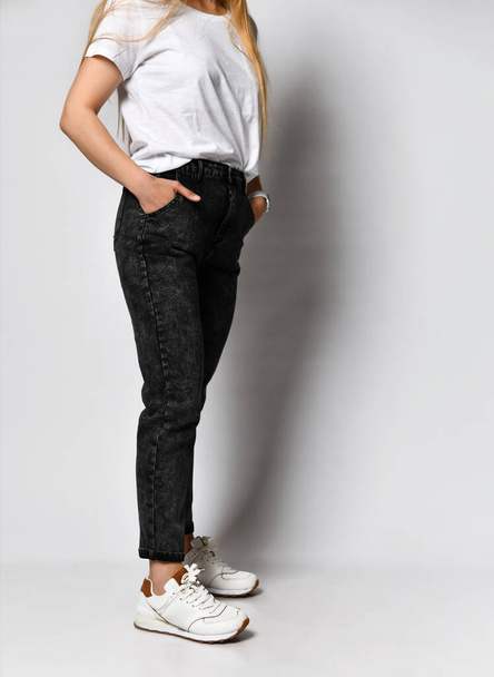 slim female figure in black fashionable jeans comfortable fit - Photo, Image