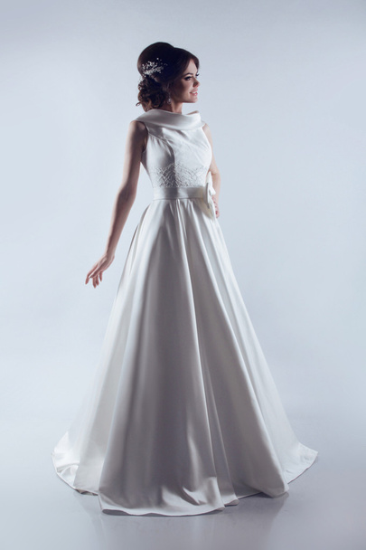 Beautiful Bride in elegant wedding dress. Fashion lady. Studio p - Fotoğraf, Görsel