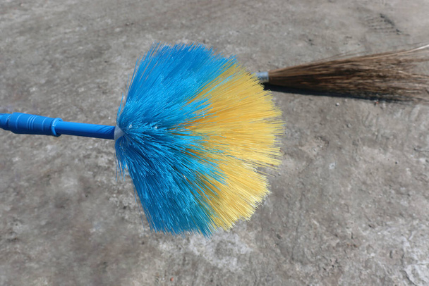 blue and yellow colored broom closeup for Cleaning - Photo, Image