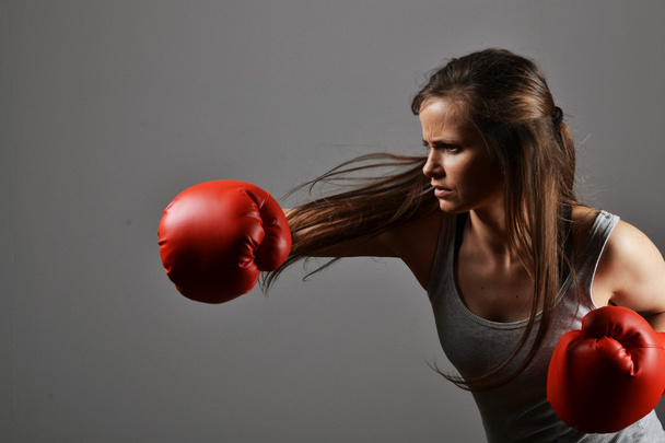 Beautiful fitness woman with the red boxing gloves - Foto, Imagen