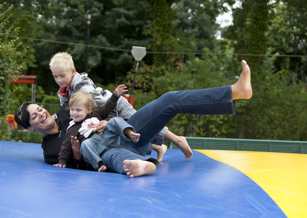 Family is having fun in the playground. - Foto, Imagen