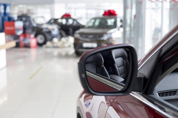 New modern unknown cars at dealer showroom. Car auto dealership. Prestigious vehicles. Themed blur background. - Zdjęcie, obraz