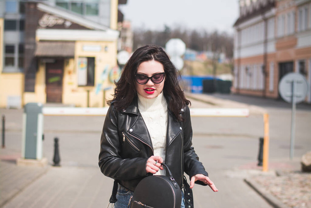 lifestyle fashion portrait of young stylish hipster woman walking on the street - Photo, Image
