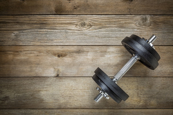 exercise concept - iron dumbbell  - Fotografie, Obrázek