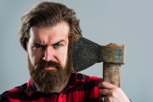 Perfect beard. logger or axeman concept. brutal bearded man lumberjack in checkered shirt - Foto, afbeelding