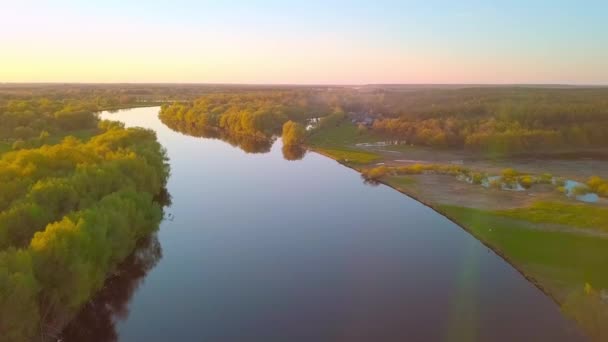 Beautiful view of the Picturesque Winding River surrounded by forest at sunset. - Footage, Video