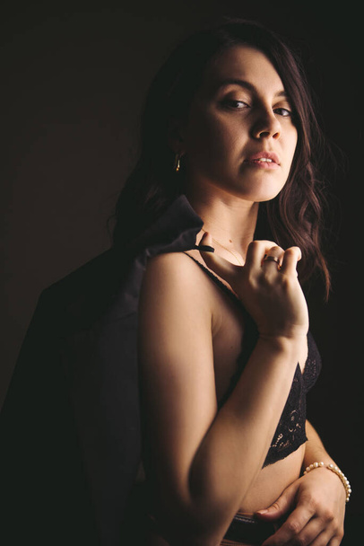 style sensual portrait of young stunning woman in brown jacket studio light - Fotografie, Obrázek