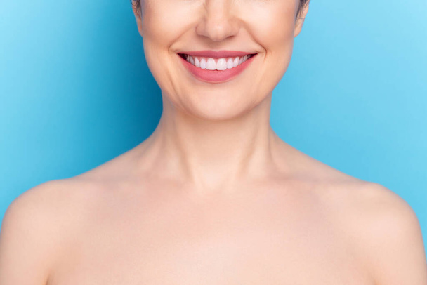 Cropped photo of young woman happy positive smile plastic surgery face correction lifting isolated over blue color background - 写真・画像