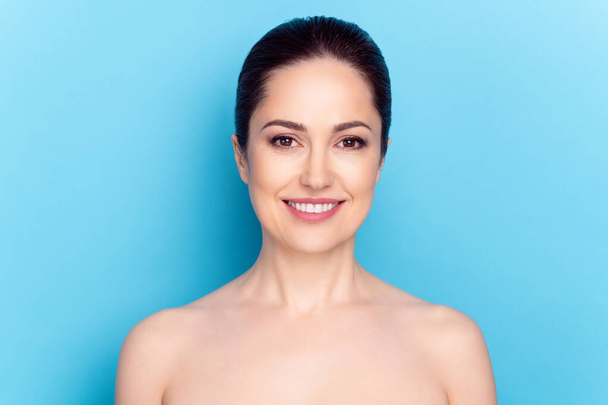 Photo of cheerful attractive woman happy positive smile enjoy spa cosmetology procedure hydration isolated over blue color background - Foto, imagen