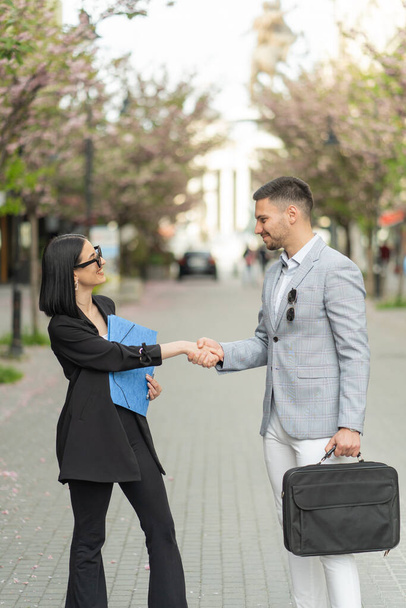 Two casual dressed business people made a deal about the partnership - Photo, Image