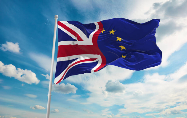 Large Union Jack And The Flag Of The European Union  waving in the wind. Brexit concept picture - 写真・画像