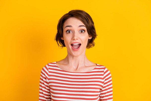 Close up photo of speechless satisfied lady staring open mouth isolated on vivid yellow color background - Foto, afbeelding
