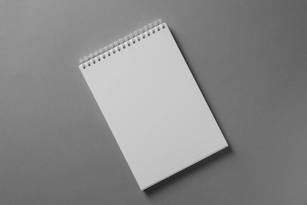 Blank notebook on light grey background, top view. Mockup for design - Zdjęcie, obraz