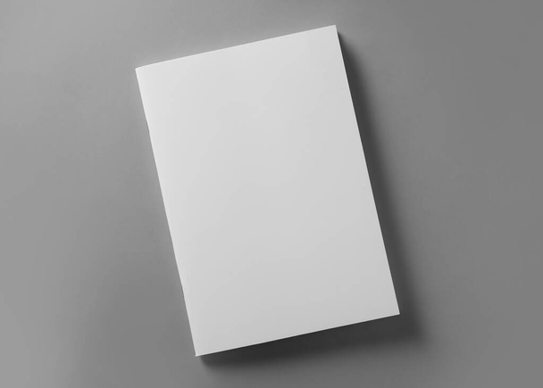 Brochure with blank cover on light grey background, top view - Фото, зображення