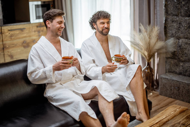 Two male in bathrobe in spa - Photo, Image