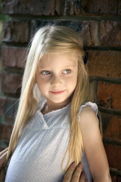 Portrait of a beautiful blonde little girl three years - Photo, Image
