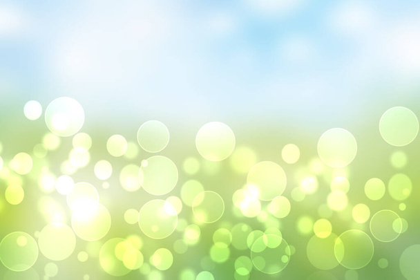 Hello spring background. Abstract bright spring or summer landscape texture with natural green yellow bokeh lights and sunshine on blue sky. Beautiful backdrop with space. - Photo, Image