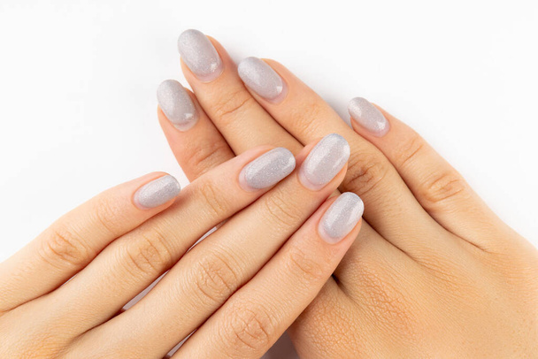 Womans hands with grown manicure on white background with copy space - Photo, Image