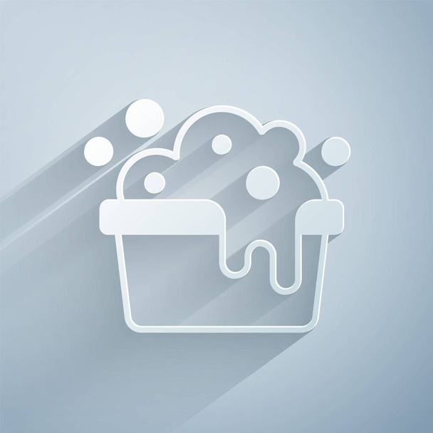 Paper cut Plastic basin with soap suds icon isolated on grey background. Bowl with water. Washing clothes, cleaning equipment. Paper art style. Vector - Vector, Image