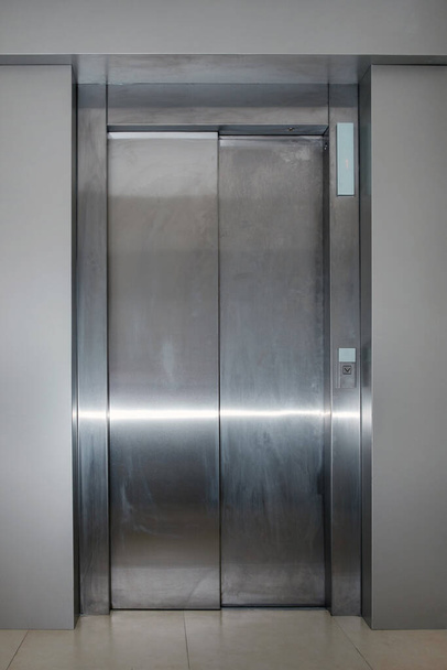 closed metallic dirty passenger lift door  - Photo, Image