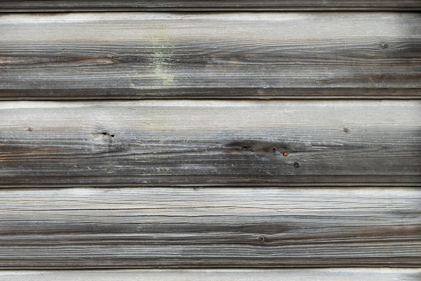 Natural wooden background from old blackened boards. Texture of old cracked weathered plank - Photo, Image