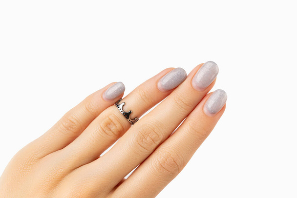 Womans hand with grown manicure on white background with copy space - Photo, Image
