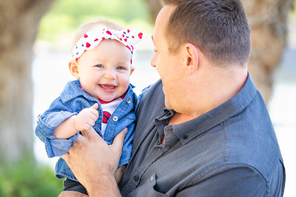 Young Caucasian Father and Baby Girl At The Park. - Photo, Image