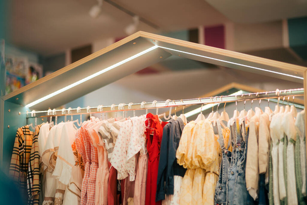 Clothes Hanging on Rack in Children Fashion Store - Fotoğraf, Görsel