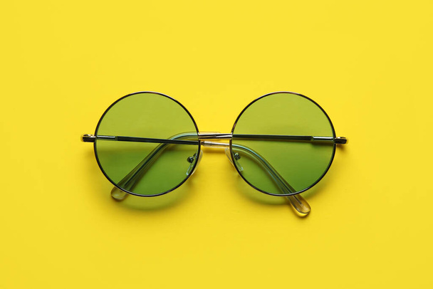 Stylish sunglasses on color background - Zdjęcie, obraz