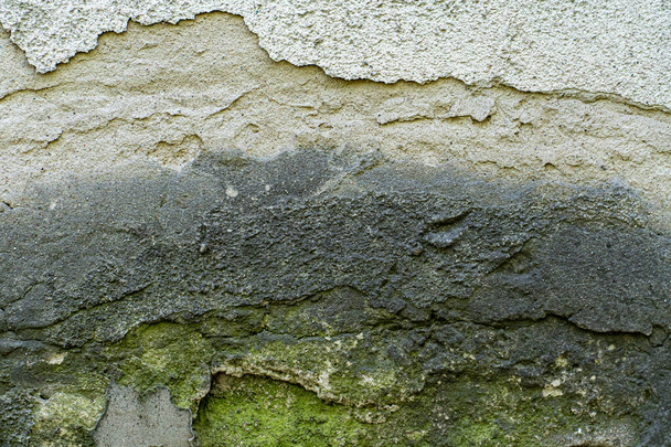 The texture of a stone wall, flooring, concrete destruction, metal corrosion and rusty antiquity, the basis of construction reinforcement and ceilings, paint chips - Photo, Image