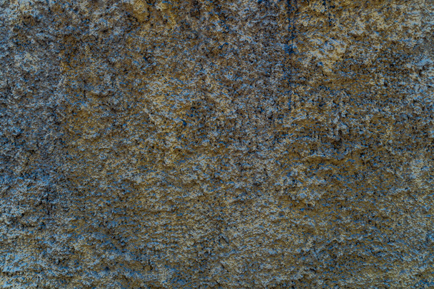 La textura de una pared de piedra, pisos, destrucción de hormigón, corrosión de metal y la antigüedad oxidada, la base de refuerzo de la construcción y techos, chips de pintura - Foto, imagen